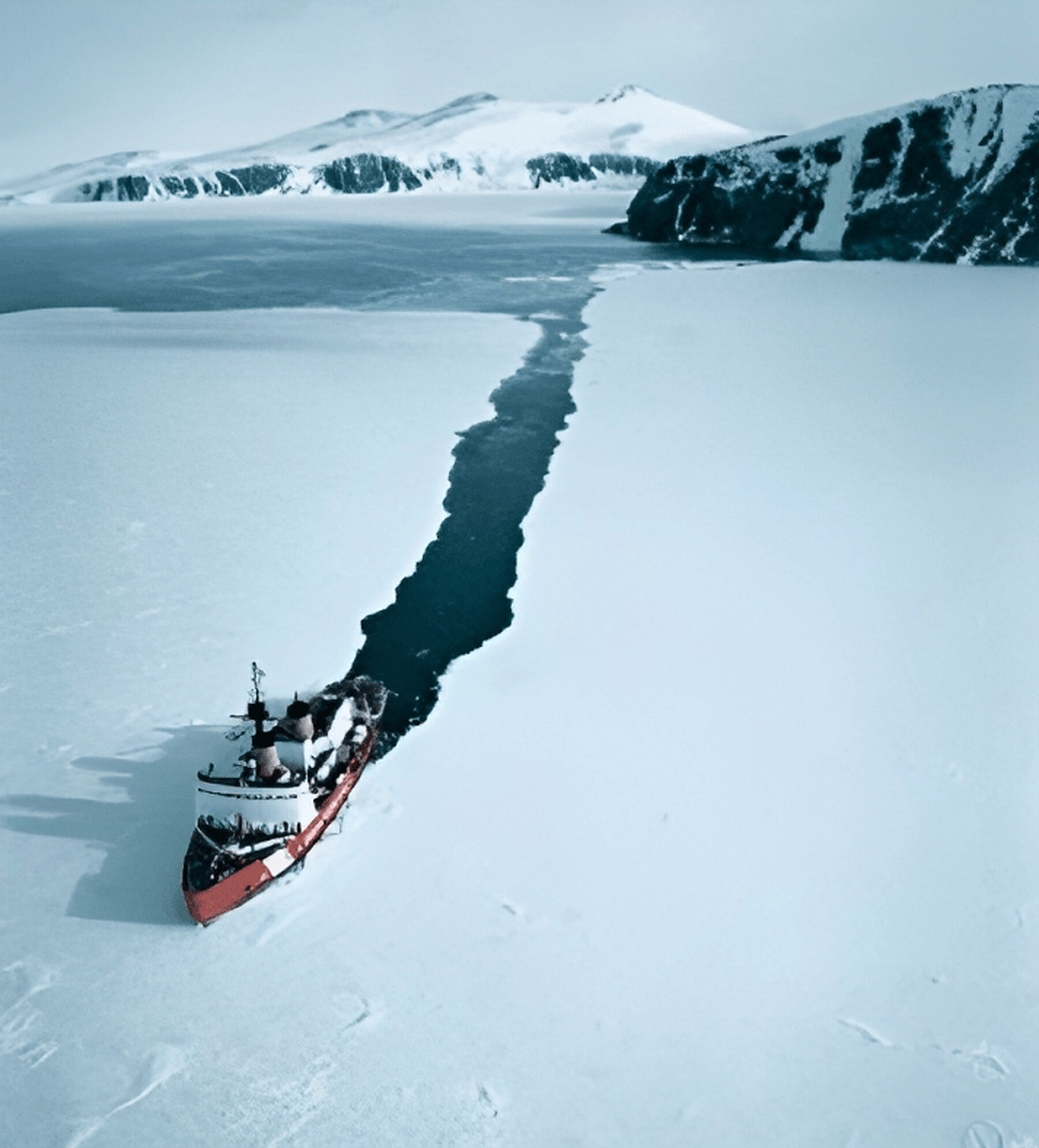 An icebreaker opening a channel through sea ice