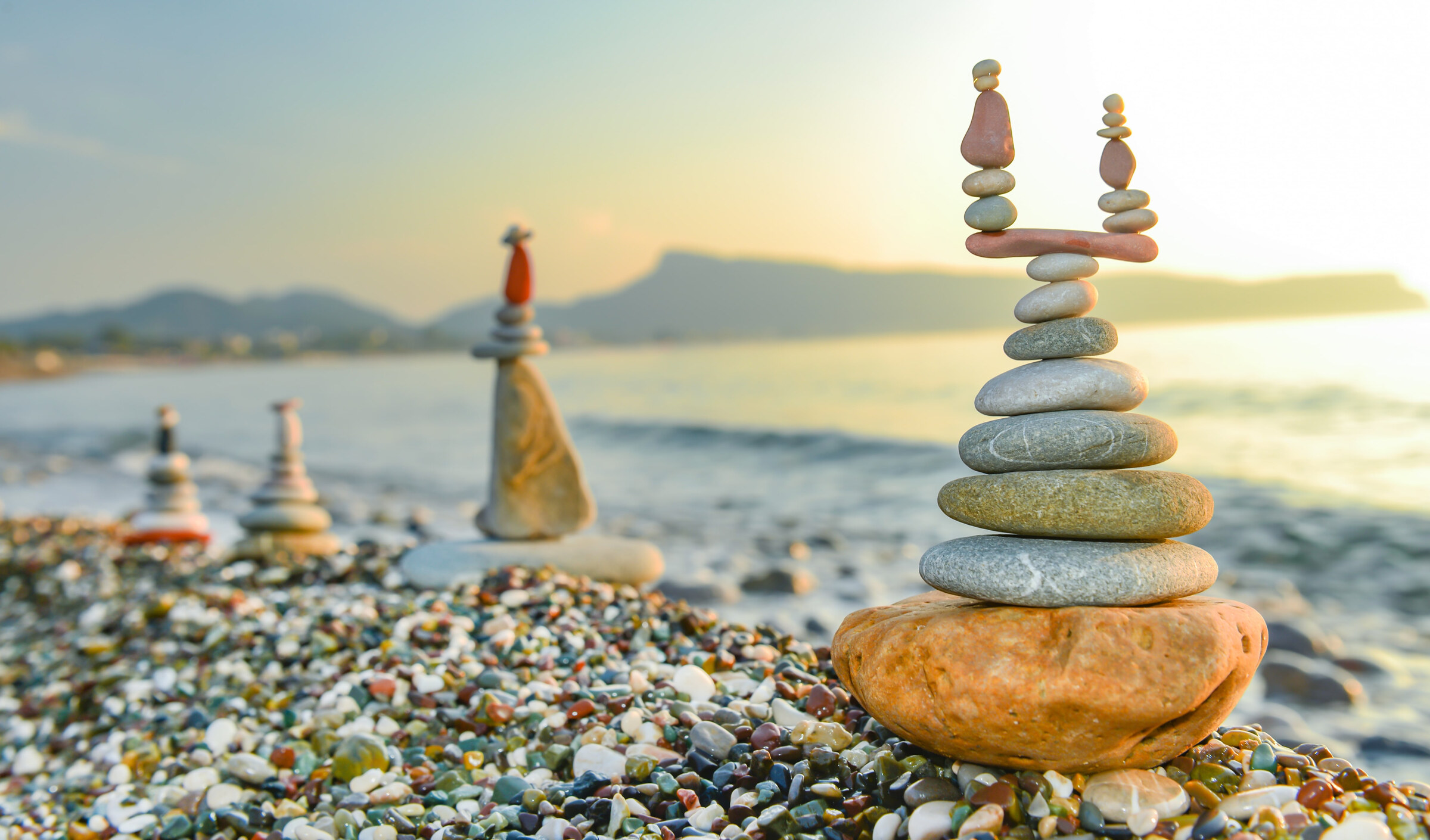 Balanced stones on a shoreline