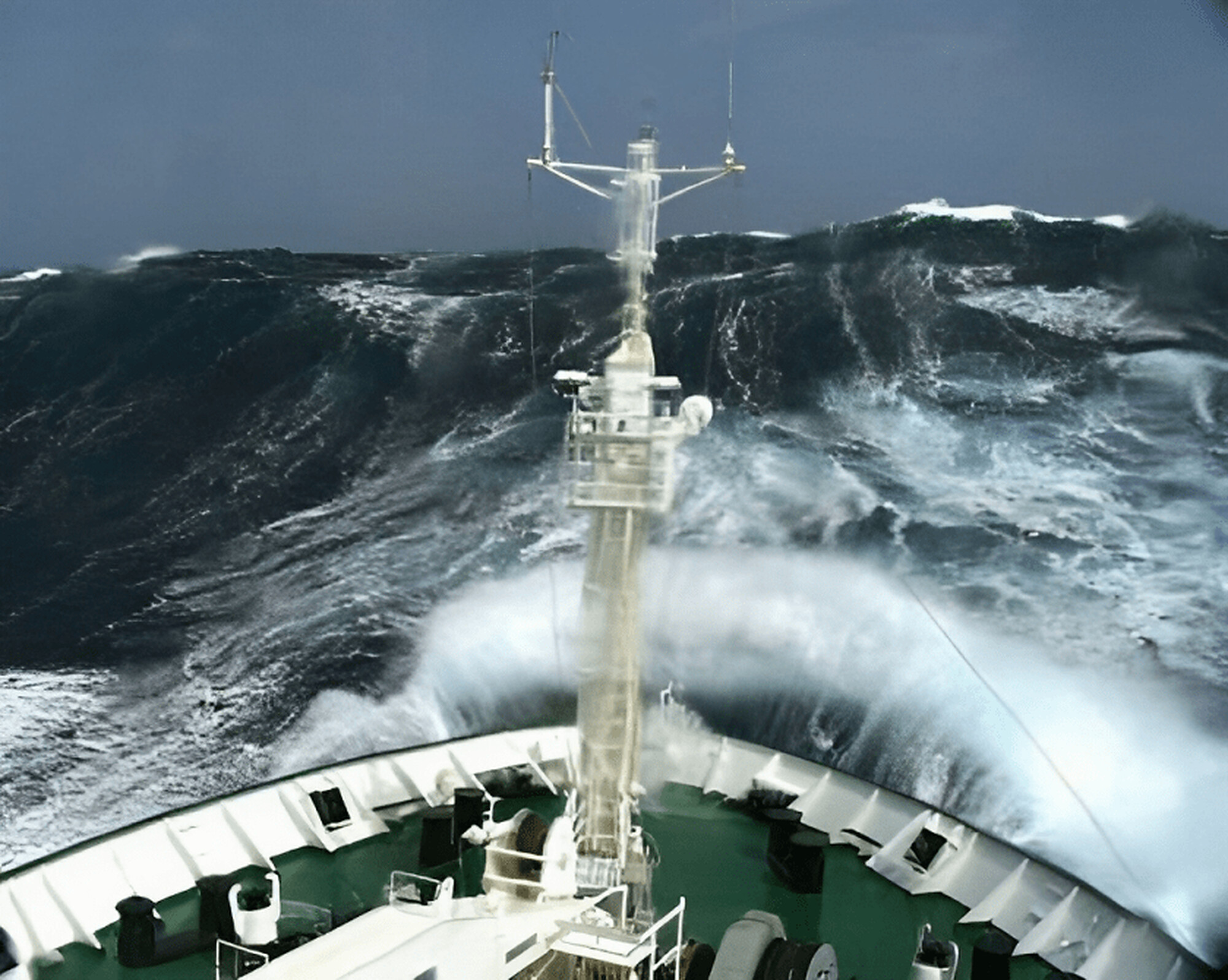 A ship’s bow cutting through a heavy sea